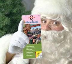 Santa with copy of HillQuest's seventh edition