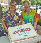 Ann Garwood & Nancy Moors cutting the cake at the the Hop in the Hood
