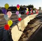 hursday, February 23, 2012...balloons on the k-rails in anticipation of this morning's removal by the city