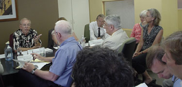 Boardmember Bob Grinchuk speaking to the Uptown Partnership meeting on Thursday, August 6, 2009