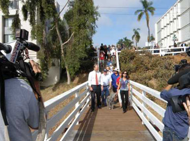City Councilman Kevin Faulconer leads the first group over the newly reopened Quince Street Footbridge