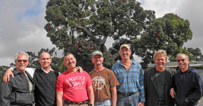 Filbert Vigil and friends in front of century-old tree that he is trying to save