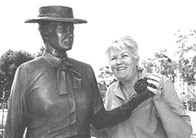 Sculptor Ruth Hayward with her statue of Kate Sessions