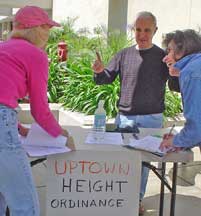 Jay and Julie collecting signatures of support for the Interim Height Ordinance at Ralph's grocery store